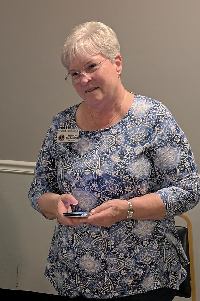 Lion Melinda giving announcements